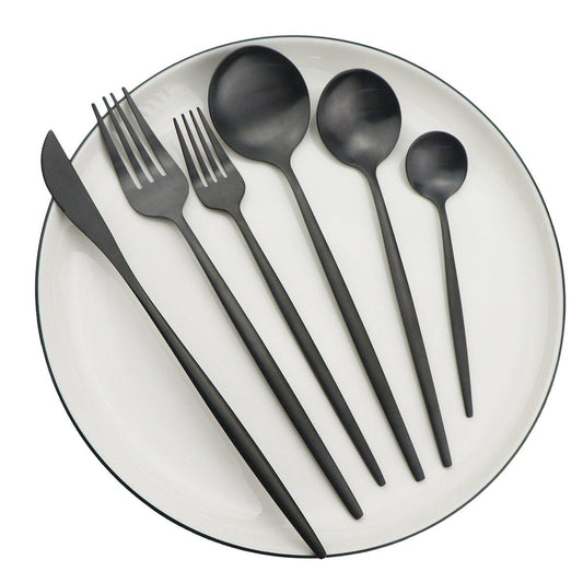 Fitlybuy Torin 36-piece matte black minimalist stainless steel cutlery set arranged on a white plate.