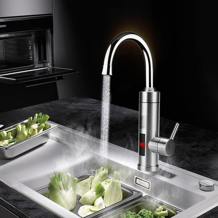 Fitlybuy stainless steel electric faucet with digital temperature display, shown dispensing hot water into a kitchen sink.