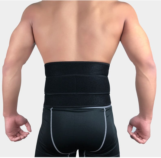 Man wearing black Fitlybuy lumbar support belt with ComfortFlex technology over dark athletic shorts, back view.