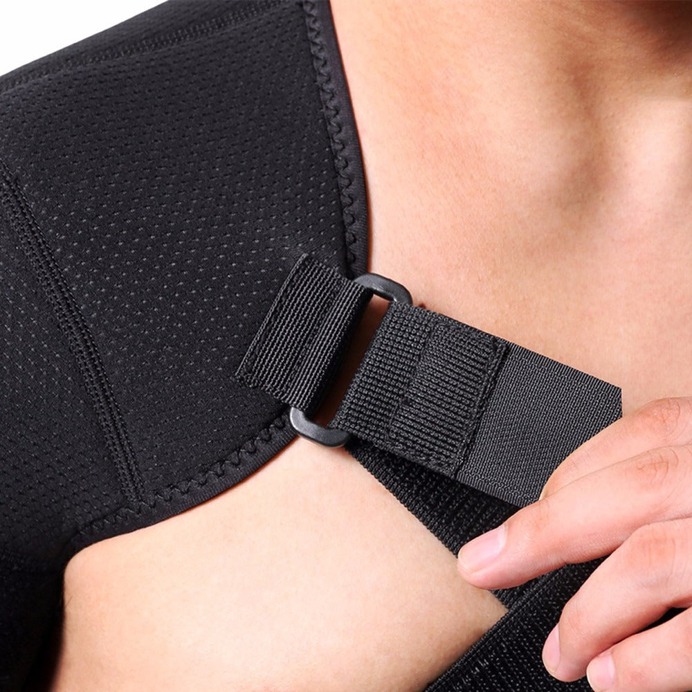 Fitlybuy black dual shoulder compression wrap with adjustable hook-and-loop strap being tightened on a person's shoulder.