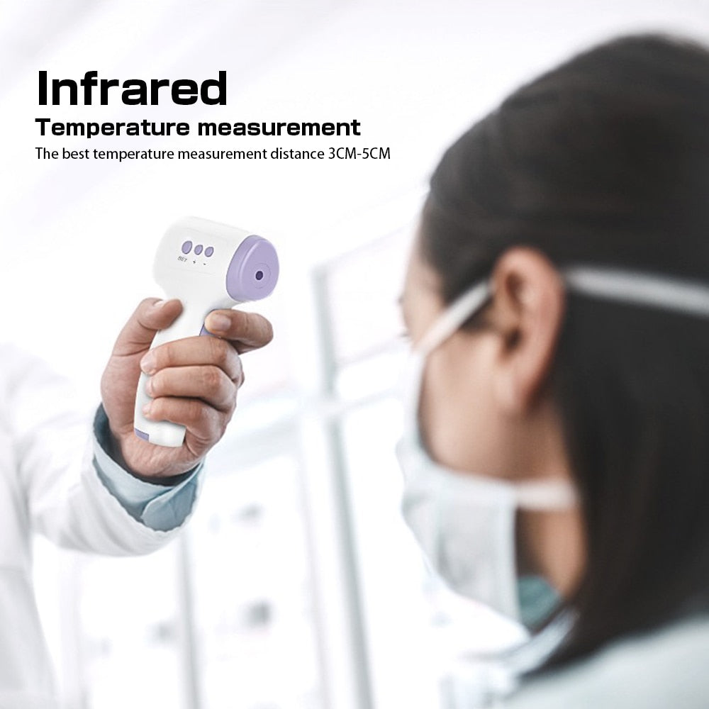 White and purple Fitlybuy non-contact infrared thermometer being used to check a patient’s temperature.