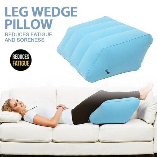 Fitlybuy blue inflatable leg wedge pillow with ComfortAir support, shown elevating a woman’s legs on a white sofa.