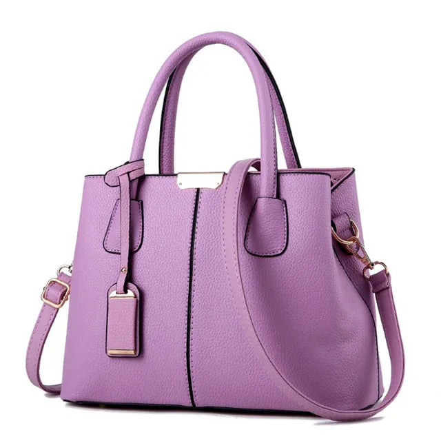 Lavender PU leather Fitlybuy Emily handbag with top handles, detachable crossbody strap, and gold-tone hardware.