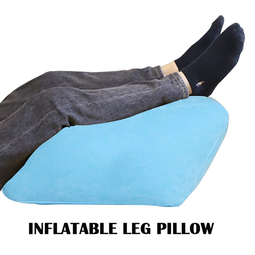 Fitlybuy soft blue inflatable leg pillow with ComfortAir support supporting elevated legs of a person wearing socks.