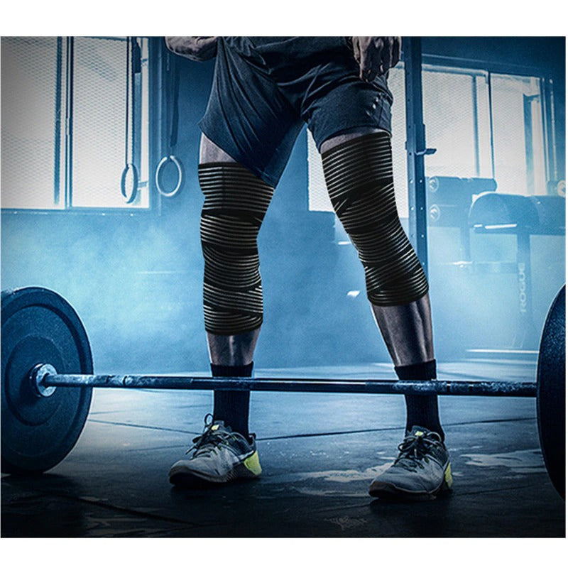 Fitlybuy elastic compression knee bandages in black with striped patterns, worn by a lifter in a gym setting.