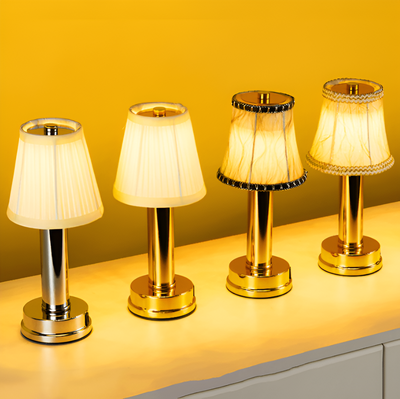 Four Fitlybuy vintage flare portable LED table lamps with gold/silver aluminium bases and diverse fabric shades.