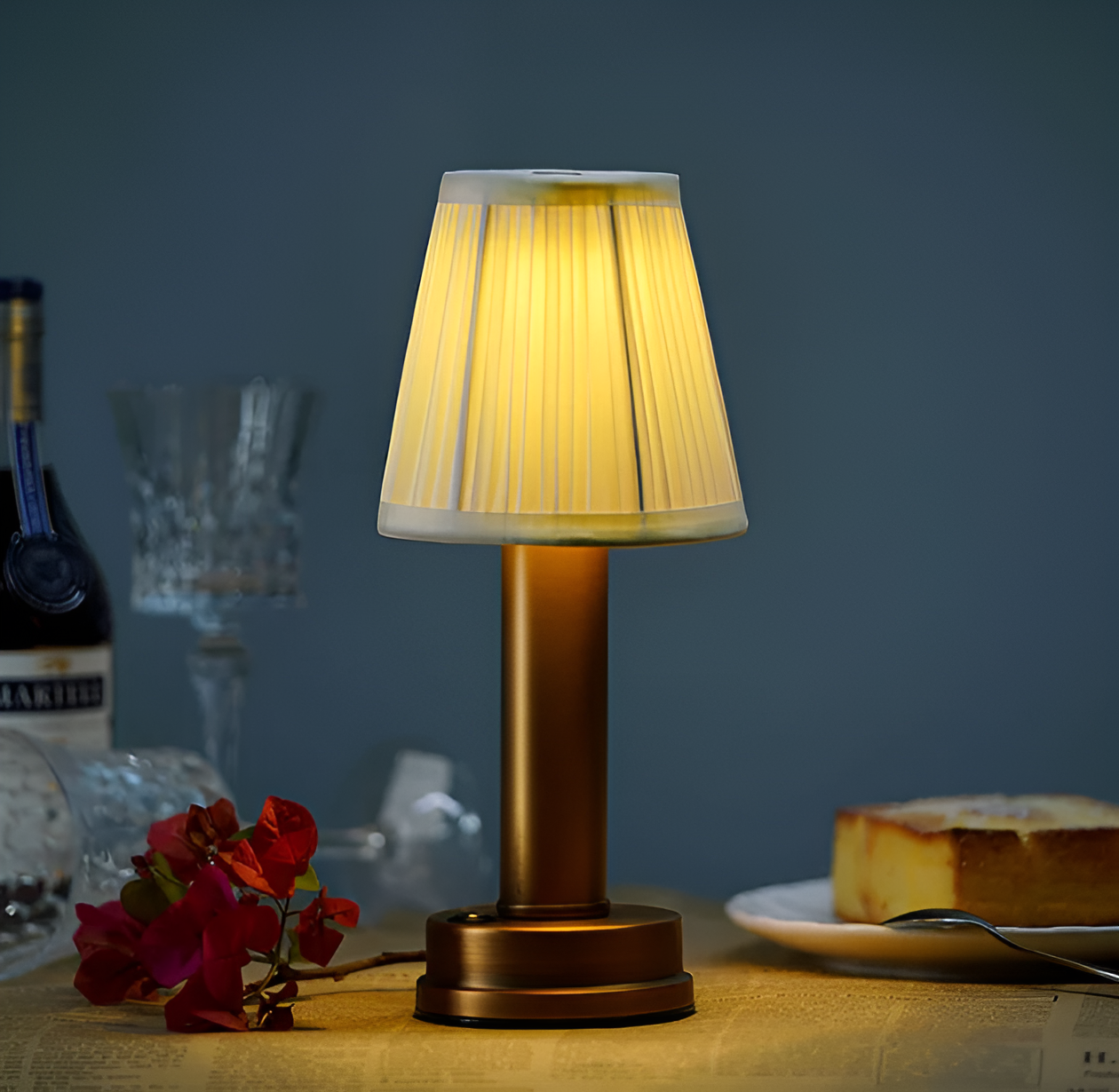 Fitlybuy vintage dimmable gold aluminum table lamp with a pleated fabric shade, glowing on a table with a meal.