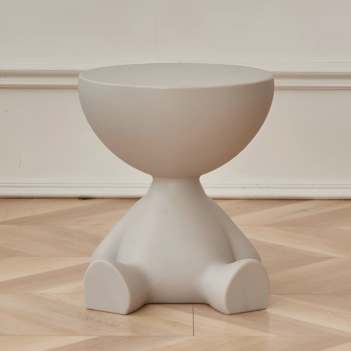 Fitlybuy Ylix round coffee table, matte grey, sculptural, minimalist figure-shaped design on a wood floor.
