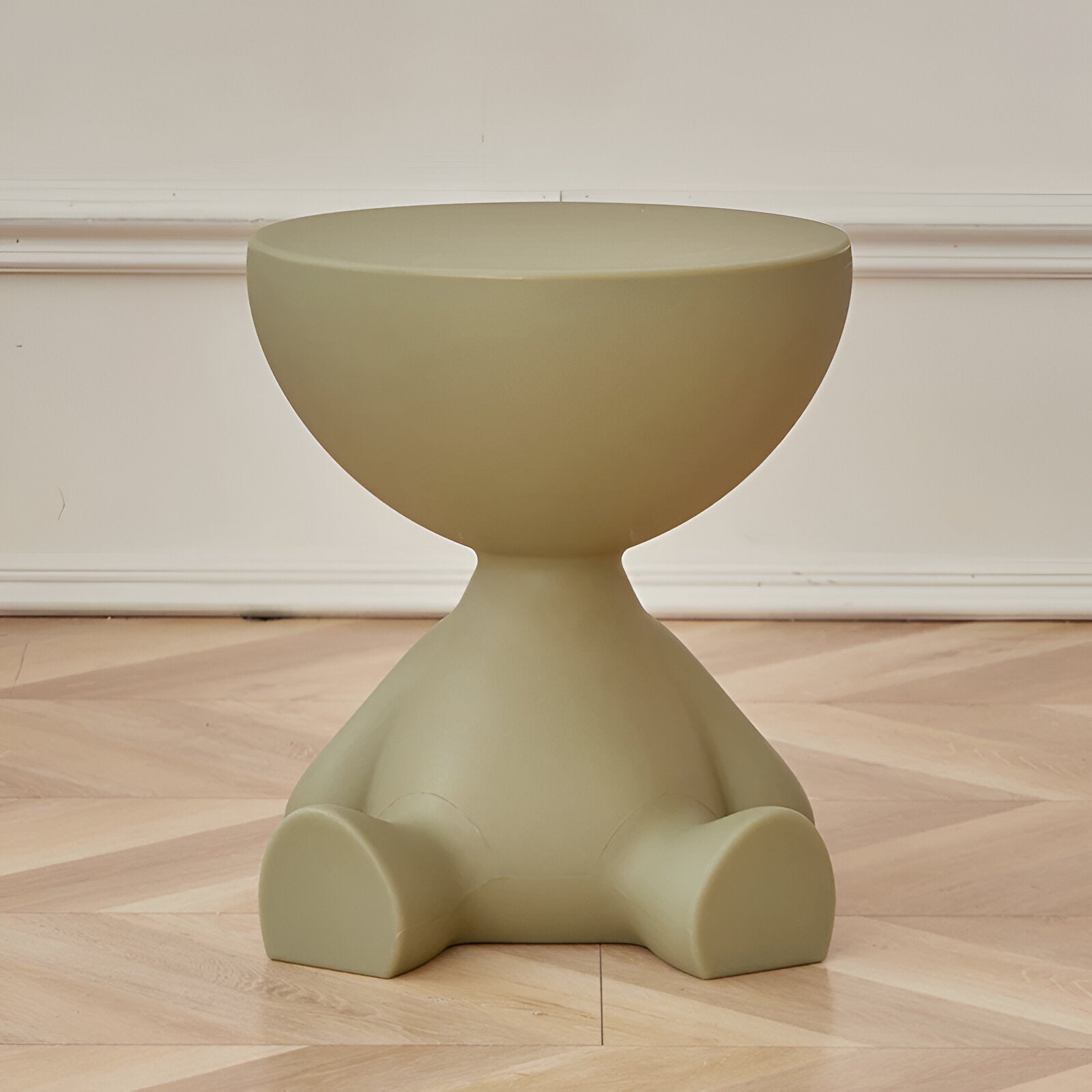 Fitlybuy Ylix olive green, round, seated figure-shaped coffee table on a light herringbone wood floor.