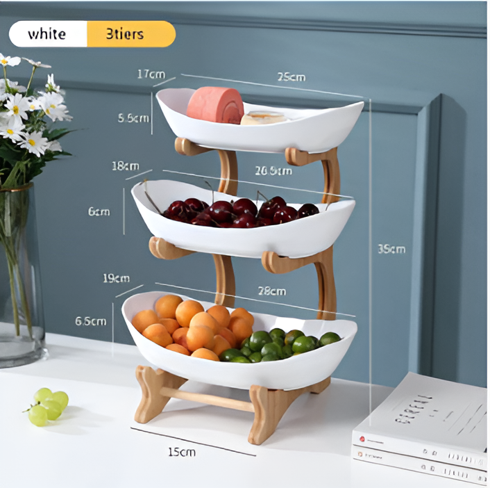 Fitlybuy white 3-tier wooden fruit bowl stand with fruit and dimensions displayed on a table.