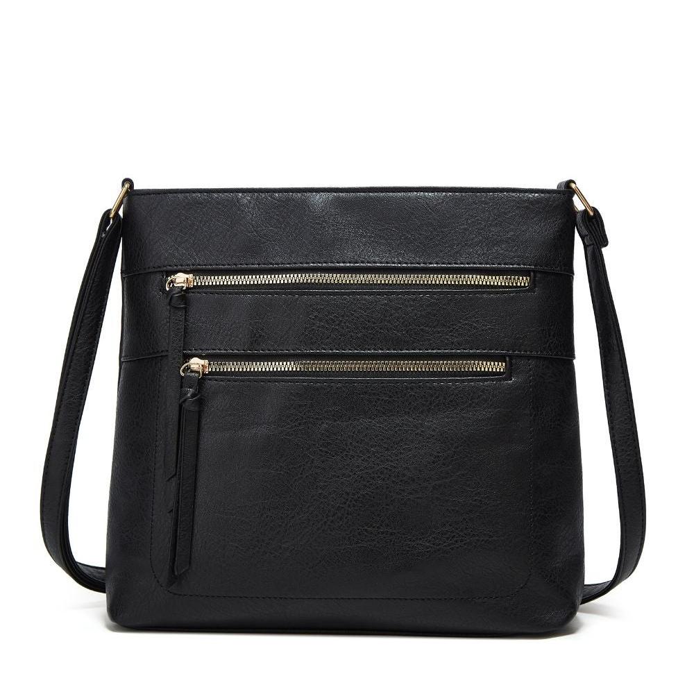 Fitlybuy Nina black genuine leather crossbody bag with two front gold-zippered pockets and an adjustable strap.