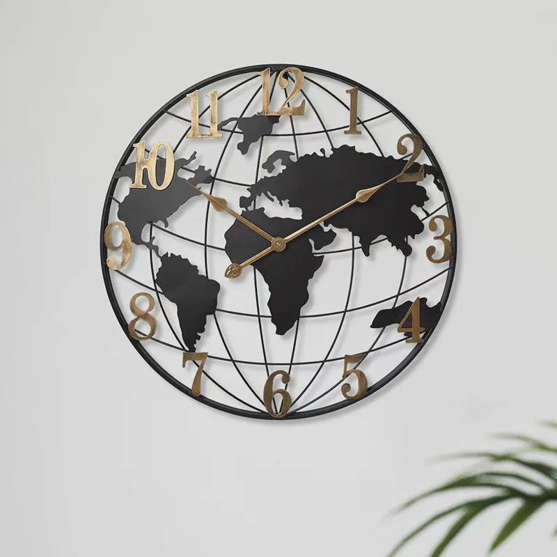 Fitlybuy 60cm black metal world map wall clock with gold numbers and hands, hanging on a plain light wall.