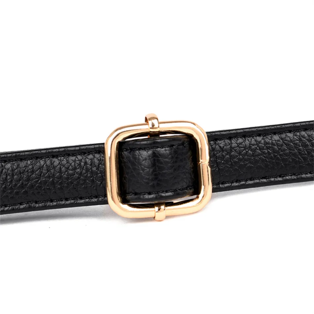 Close-up of a black pebbled PU leather shoulder bag strap with an adjustable gold-tone metal square buckle.