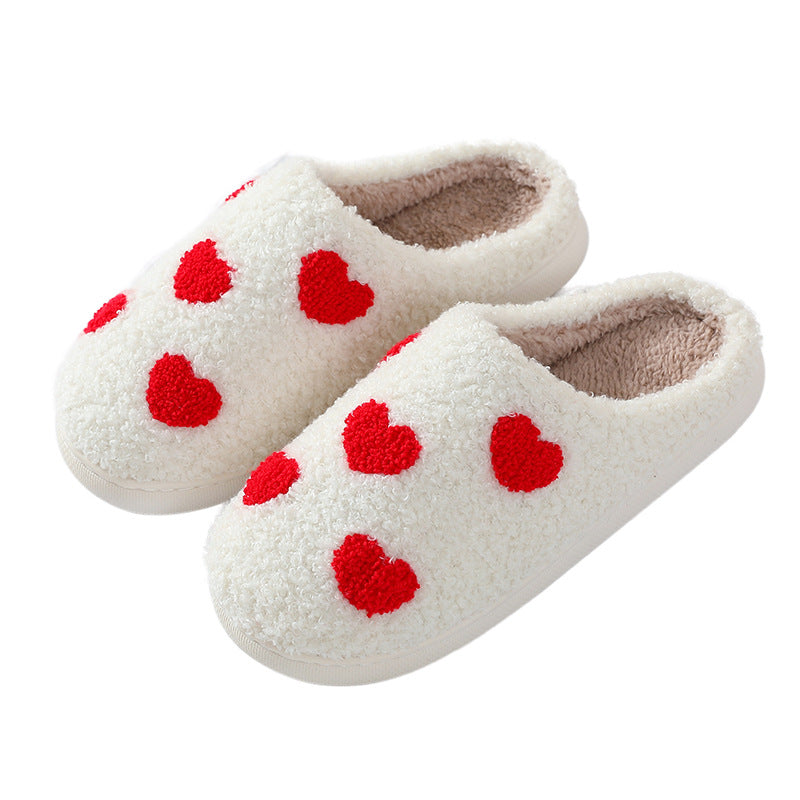 Fitlybuy Nordic memory foam slippers in white fleece with red heart patterns, isolated on a white background.