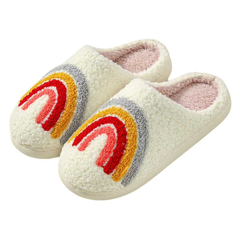 Fitlybuy Nordic memory foam slippers in white fleece with a fuzzy rainbow design and plush pink interior lining.