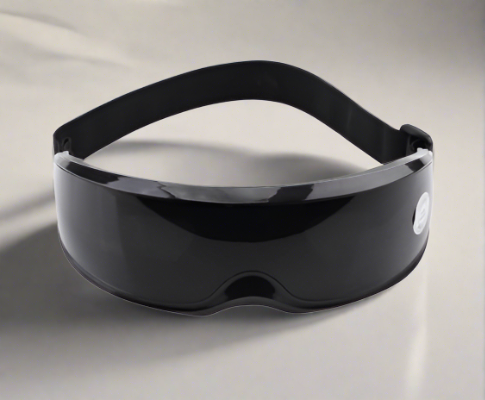 Glossy black Fitlybuy wireless eye relief massager with heat therapy and adjustable strap on a neutral background.
