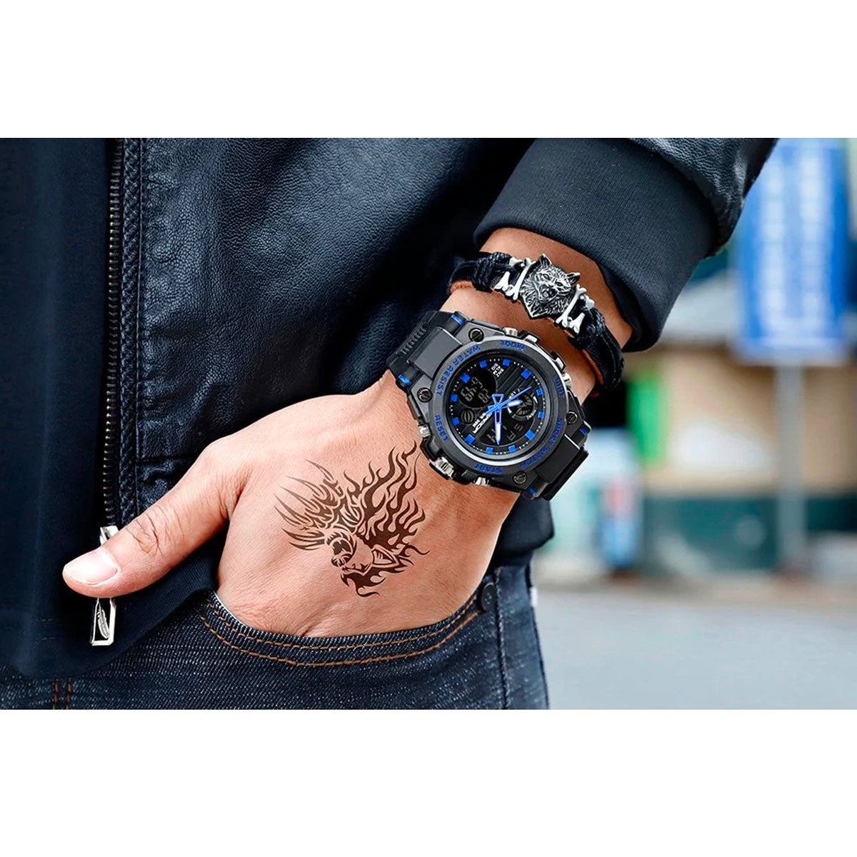 Fitlybuy TitanGuard black and blue analog-digital military watch with rugged bezel worn on a tattooed wrist.
