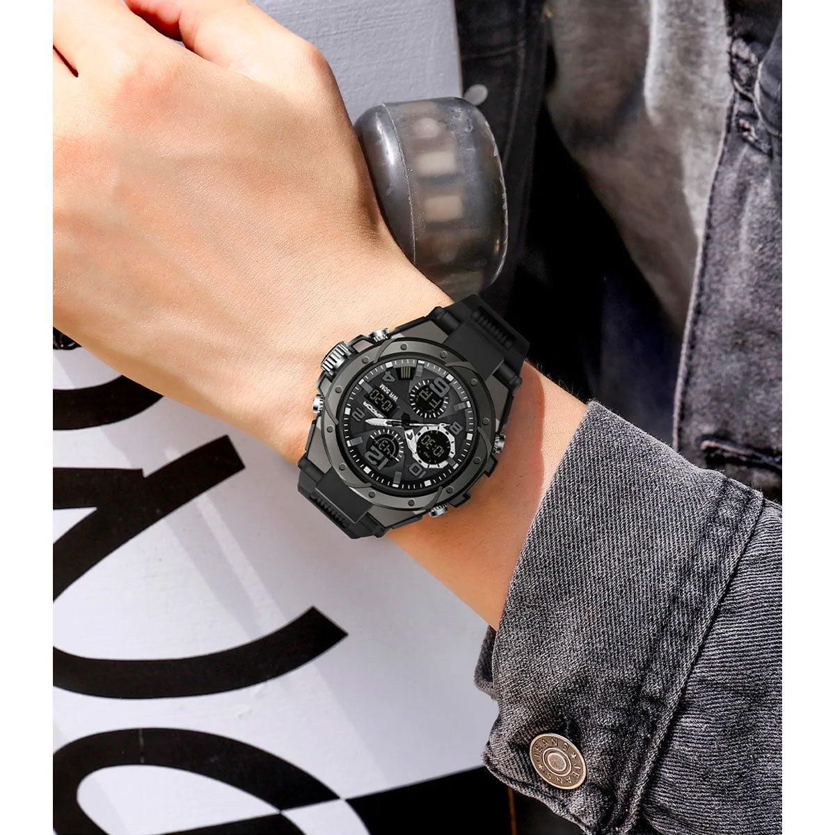 Fitlybuy TitanGuard black analog-digital tactical watch with rugged bezel worn on a wrist with denim jacket.