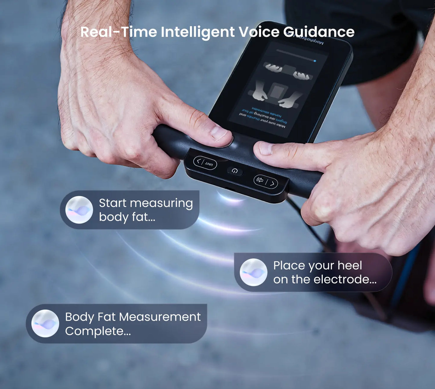 Hands holding the black Fitlybuy MorphoScan Nova scale handle, showing the display interface and voice guidance prompts.