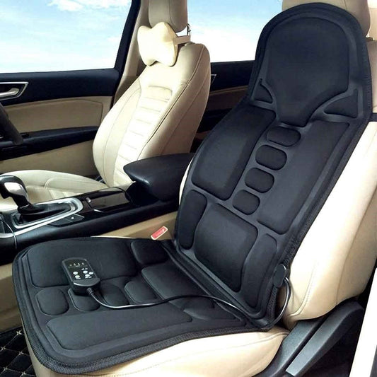 Black Fitlybuy 8-mode heated massage chair pad with remote control installed on a beige car seat for relaxation.