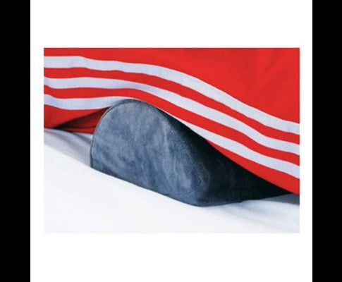 Fitlybuy navy blue semi-circular memory foam foot rest placed on a bed under a red striped blanket.
