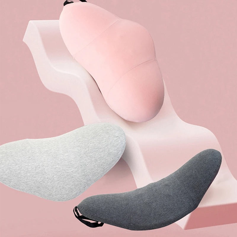 Fitlybuy ergonomic memory foam lumbar pillows in pink, light gray, and dark gray arranged on a wavy display stand.