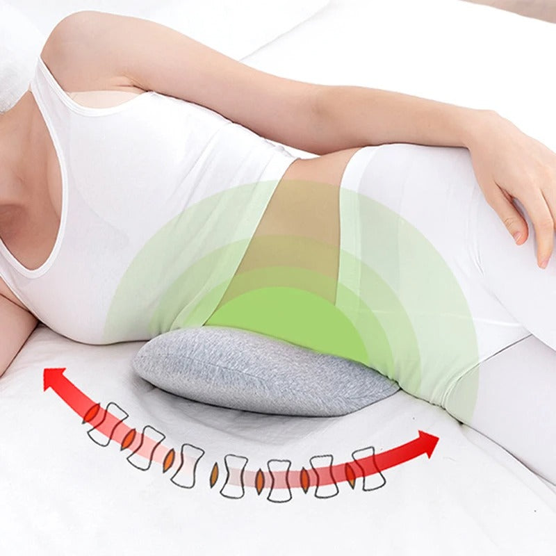 Gray memory foam lumbar pillow under a woman's lower back, illustrating ergonomic spinal alignment and support.