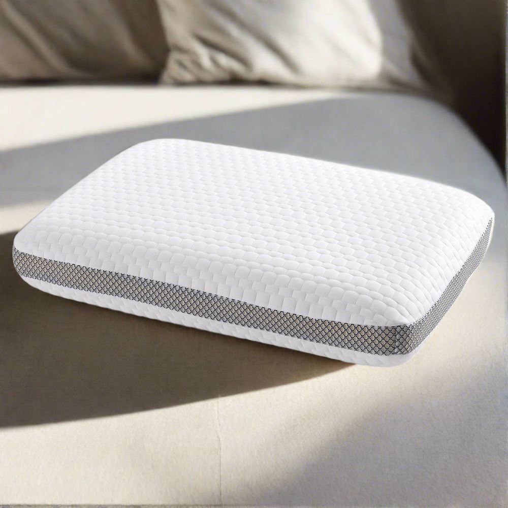 Fitlybuy white memory foam pillow with textured cover and gray mesh side panels on a bed in soft natural light.
