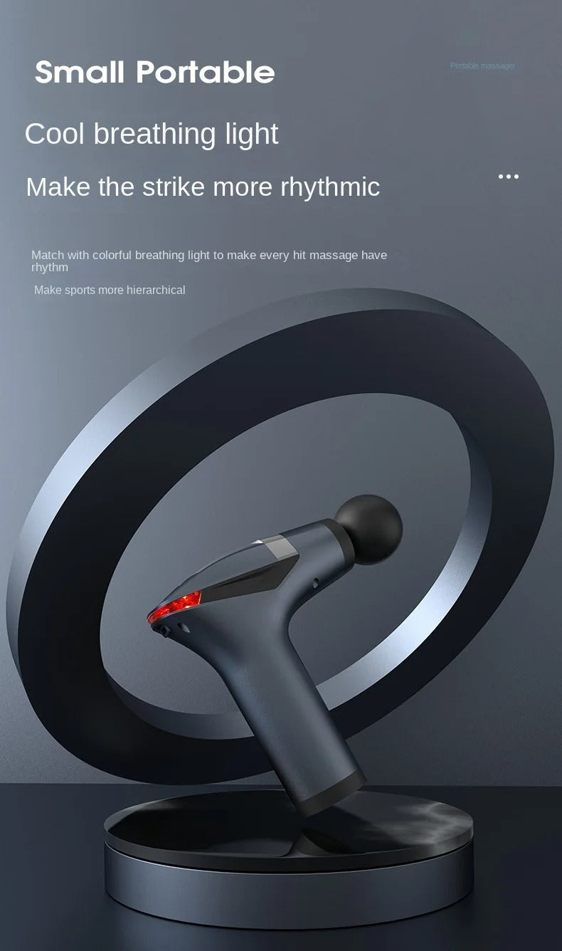 Fitlybuy long-handle dark blue massage gun with a red breathing light, displayed on a circular stand against a gray bg.