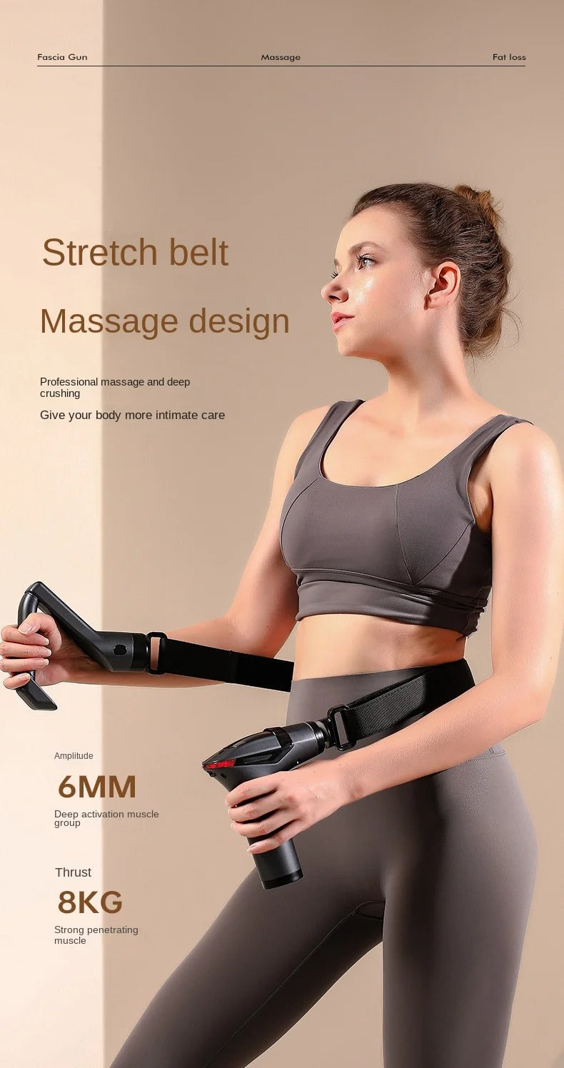Woman in gray activewear using a black long-handle Fitlybuy massage gun with a belt for back and muscle relief.