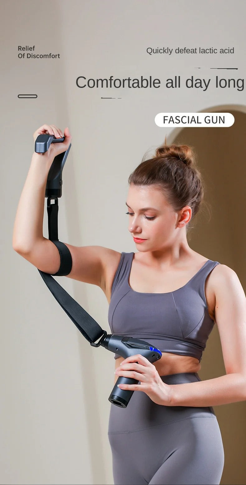 Woman using a grey Fitlybuy long-handle massage gun with a strap to target arm muscles for recovery.