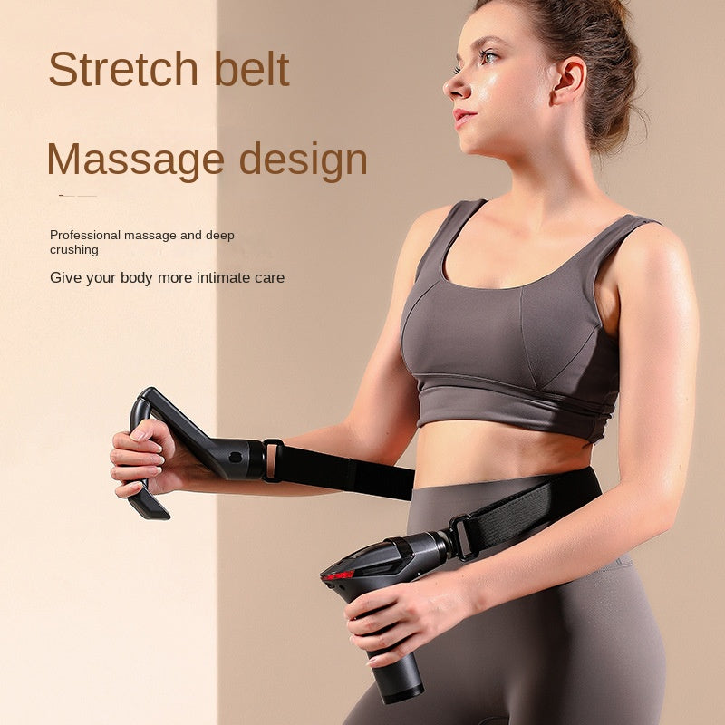 Woman in workout gear using a black Fitlybuy long-handle massage gun with an adjustable belt for back massage.