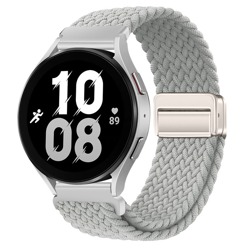 Fitlybuy grey woven nylon magnetic watch strap on a silver smartwatch with a digital fitness display.