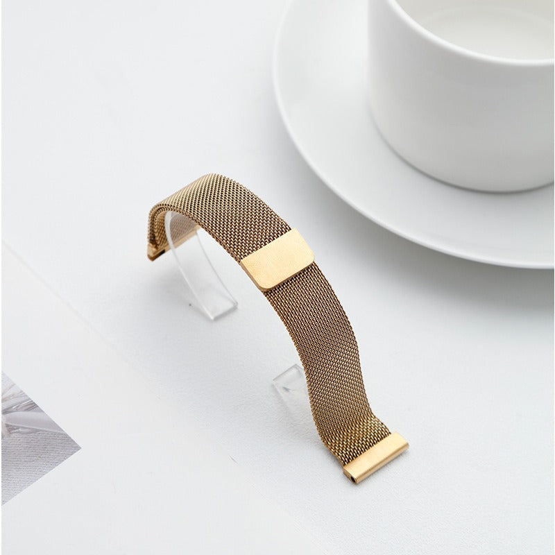 Gold Fitlybuy Milanese stainless steel mesh watch strap with adjustable quick-release design on a white surface.