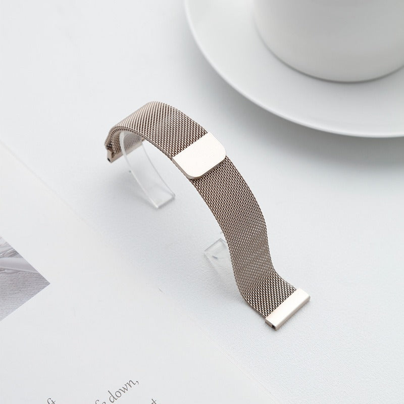 Rose gold Fitlybuy stainless steel mesh Milanese watch strap with quick-release adjustable buckle on a white surface.