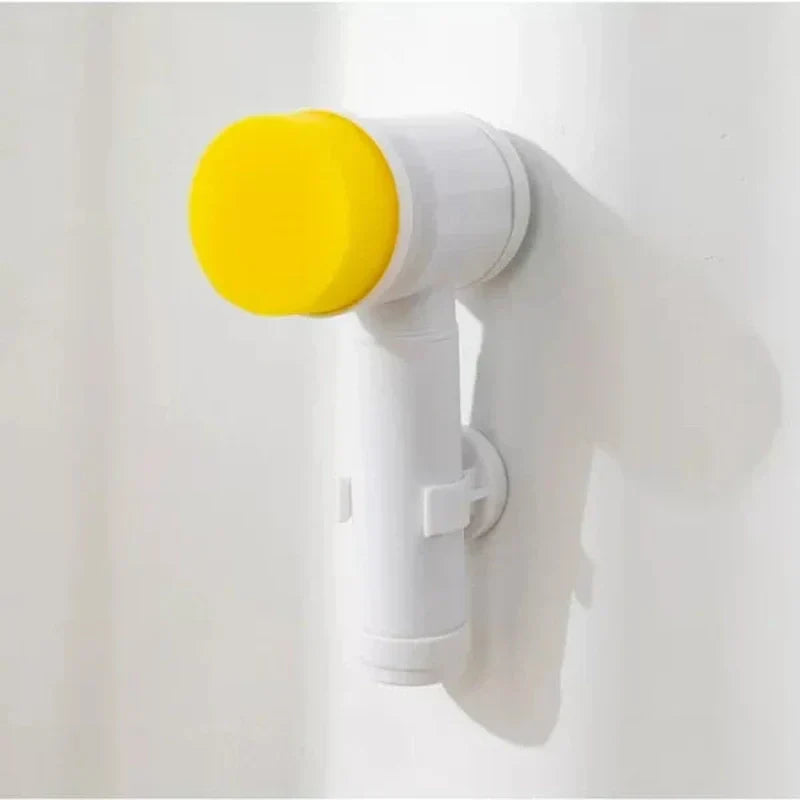 Fitlybuy PowerScrub compact cordless electric scrubber in white with a yellow brush head, mounted on a white wall.