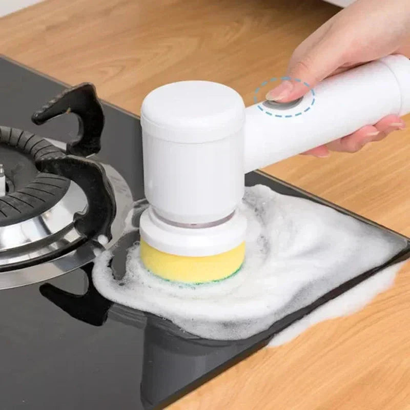 White cordless Fitlybuy PowerScrub electric brush cleaning a soapy stovetop.