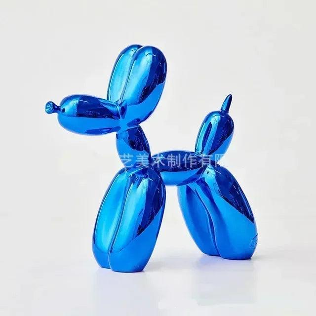 Shiny, metallic blue balloon dog sculpture in a modern, playful design isolated against a plain white background.