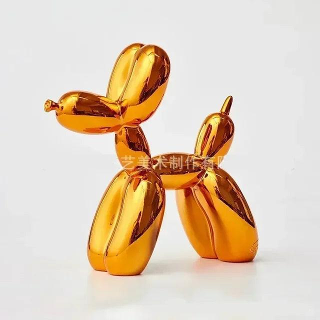 Shiny metallic gold balloon dog sculpture with a playful, modern aesthetic for contemporary home decor.