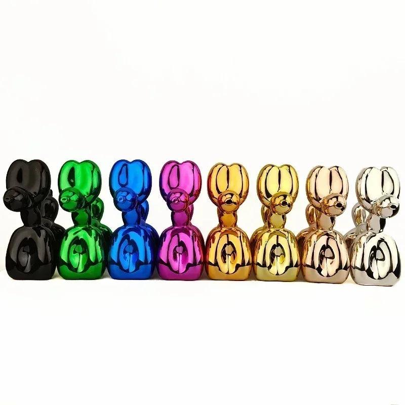 Eight glossy Fitlybuy balloon dog sculptures in various metallic colors arranged in a row against a white background.