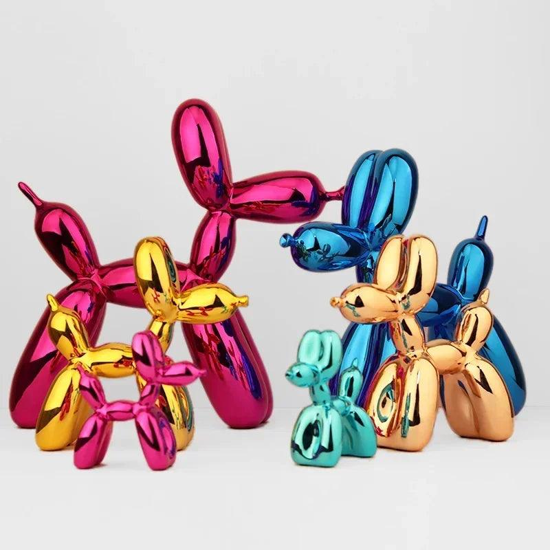 Shiny metallic balloon dog sculptures in assorted bright colors including pink, blue, gold, and teal for home decor.