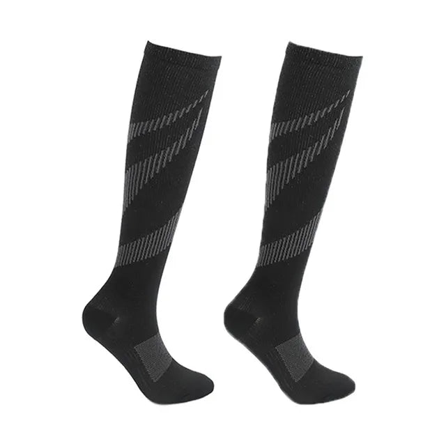 Pair of black Fitlybuy compression socks featuring grey diagonal stripes and reinforced heel/toe support on white.