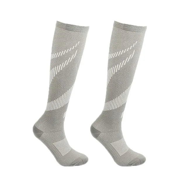 Pair of light grey Fitlybuy Easy Legs compression socks with white geometric patterns and reinforced heel and toe areas.