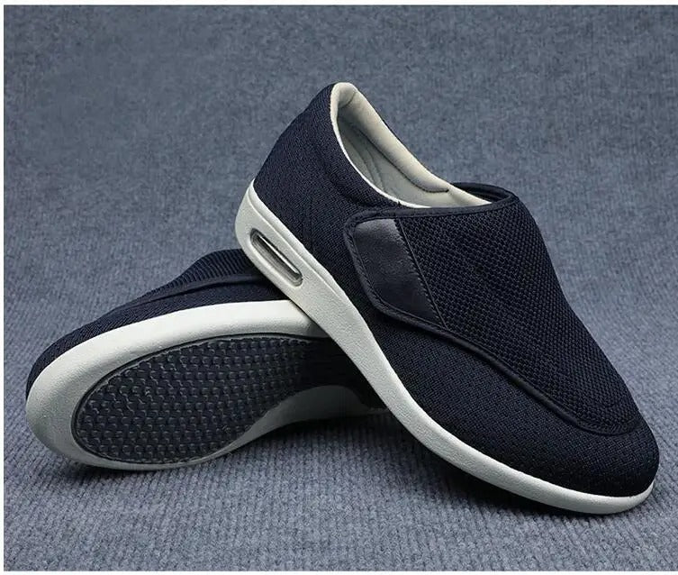 Fitlybuy navy blue orthopedic walking shoes with thick white soles, hook-and-loop closure, and textured grip base.