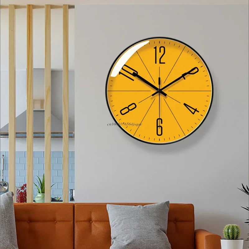 Fitlybuy TimeWisp yellow wall clock with minimalist black numbers and frame, displayed on a grey wall in a living room.