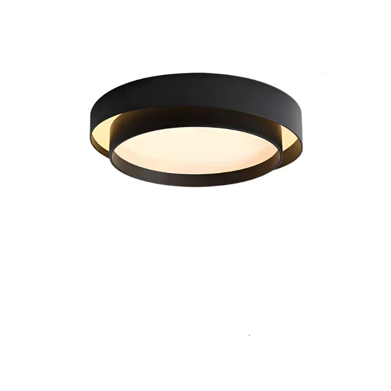 Fitlybuy NordicAura: A round, black minimalist LED ceiling light with an illuminated white center against white background.