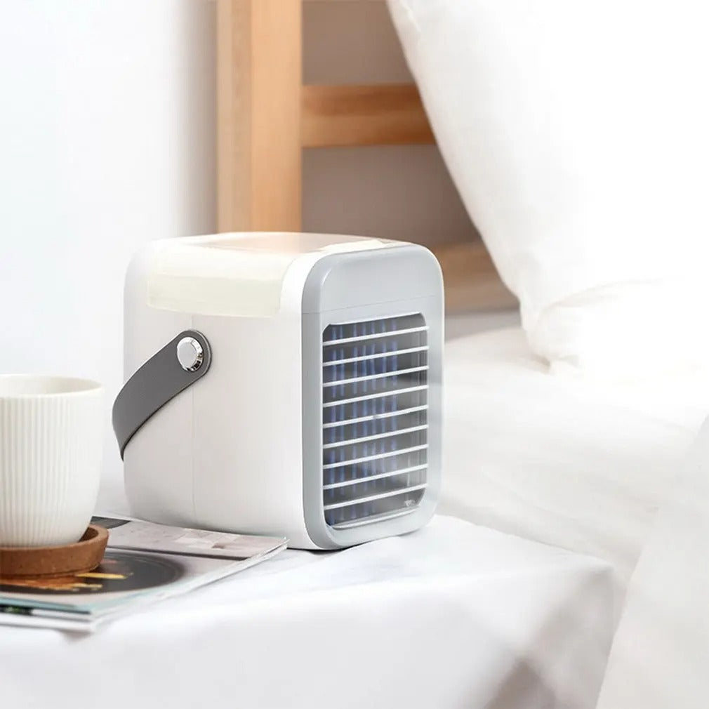 Fitlybuy 3-in-1 white and grey portable mini air conditioner with EcoCool technology on a bedroom nightstand.