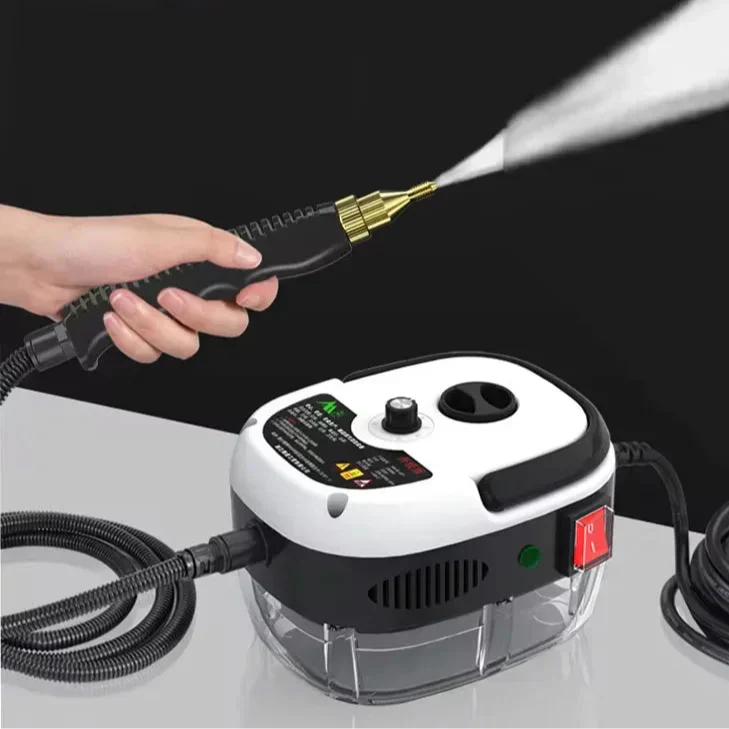 Hand holding a black and white Fitlybuy 2500W SteamVolt cleaner, spraying high-pressure steam from a brass nozzle.