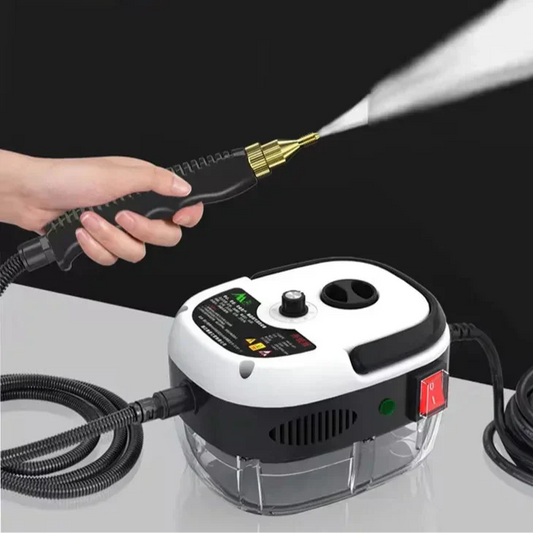 Hand holding a black and white Fitlybuy 2500W SteamVolt cleaner, spraying high-pressure steam from a brass nozzle.