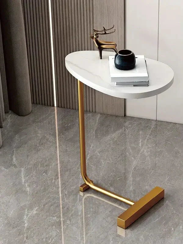 Modern Fitlybuy side table with white teardrop top and gold metal frame on a marble floor in a stylish room.